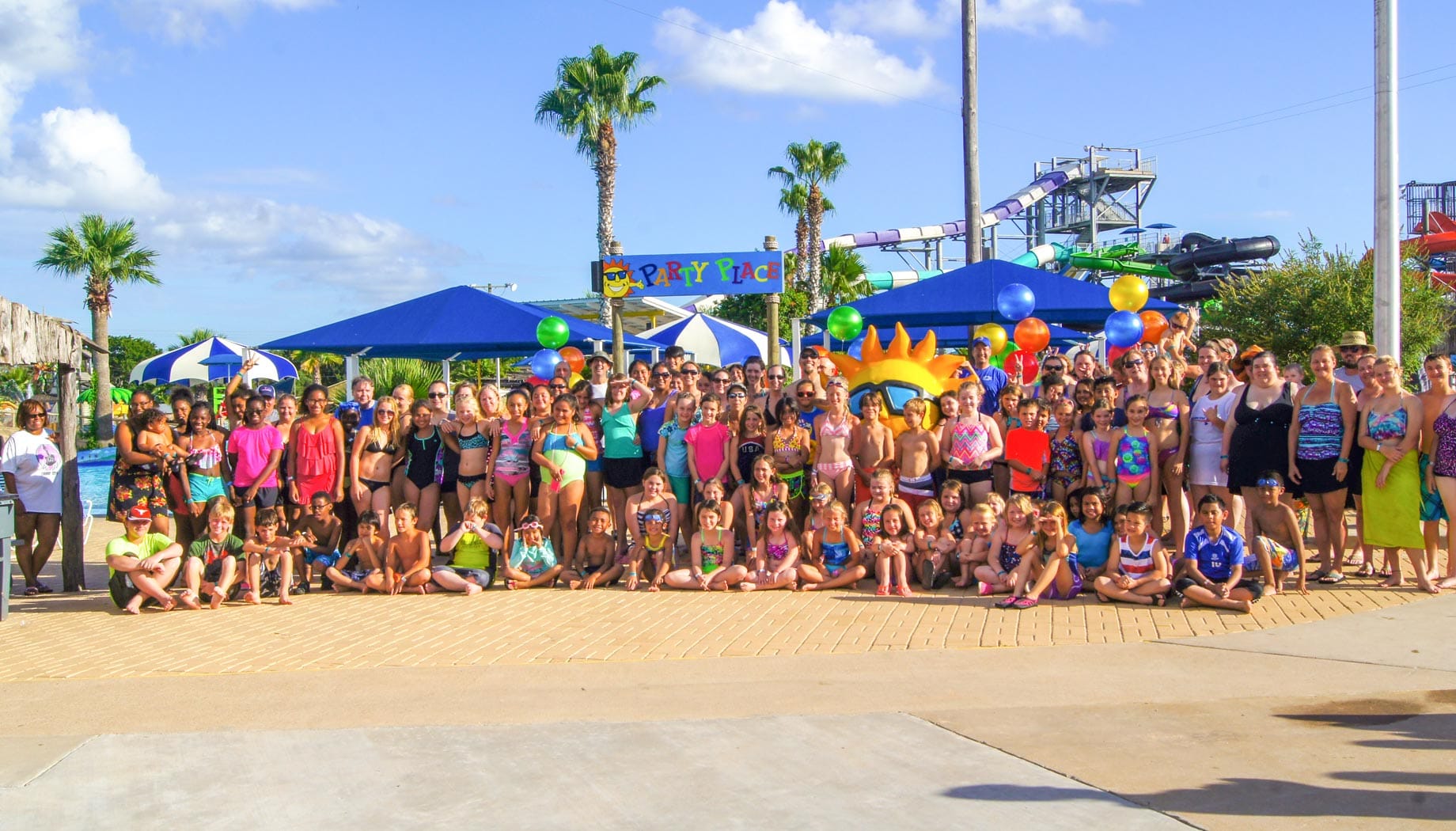 Large group posing for a birthday group photo.