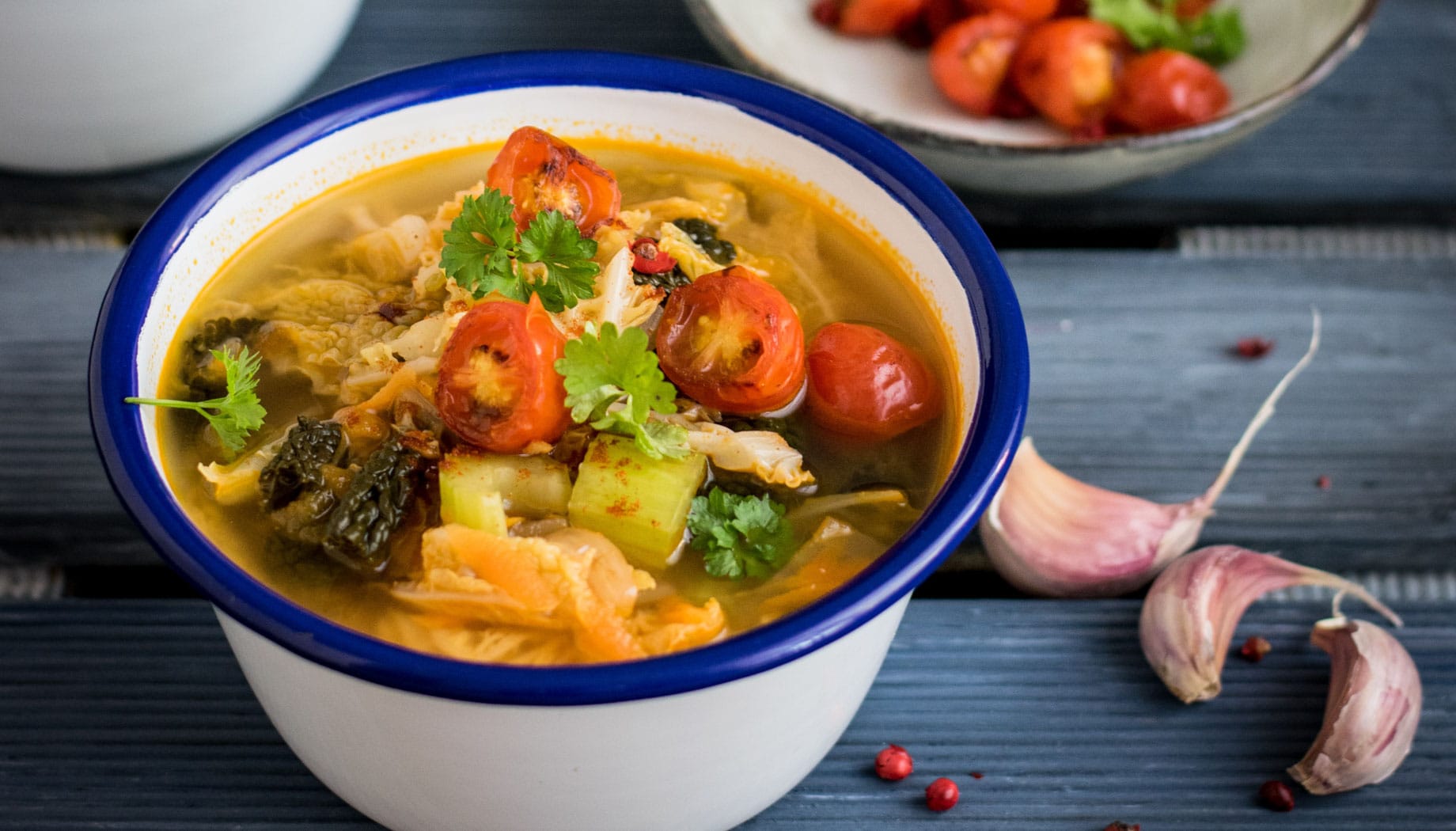 Gumbo in a white and blue cup.