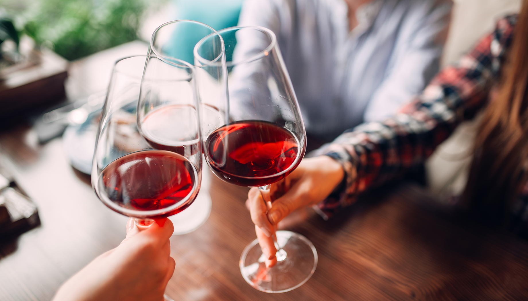 Group of people drinking red wine.